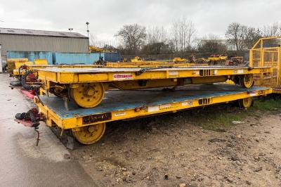 image showing a large yellow on-track machine