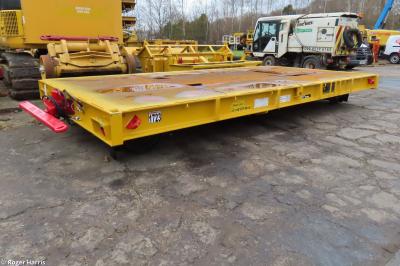 image showing a large yellow on-track machine