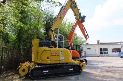 image showing a large yellow on-track machine