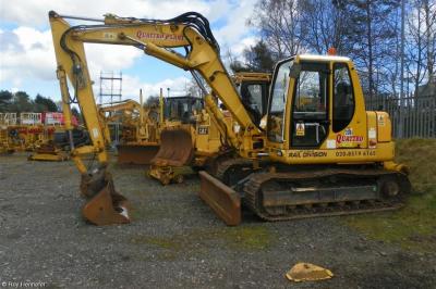 image showing a large yellow on-track machine