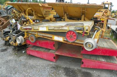image showing a large yellow on-track machine