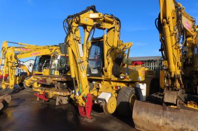 image showing a large yellow on-track machine