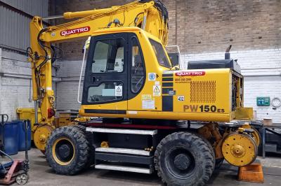 image showing a large yellow on-track machine