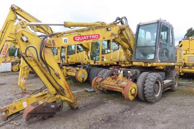 image showing a large yellow on-track machine