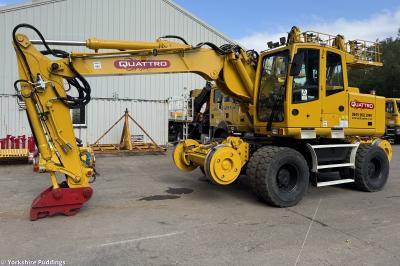 image showing a large yellow on-track machine