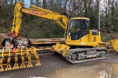 image showing a large yellow on-track machine