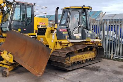 image showing a large yellow on-track machine