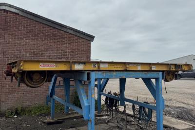 image showing a large yellow on-track machine