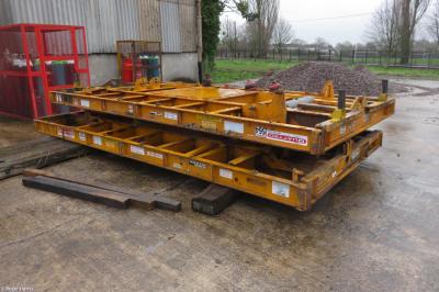 image showing a large yellow on-track machine