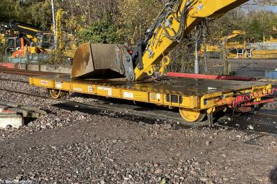 image showing a large yellow on-track machine