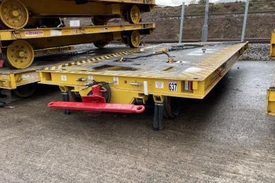 image showing a large yellow on-track machine