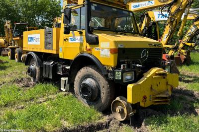 image showing a large yellow on-track machine