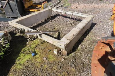 image showing a large yellow on-track machine