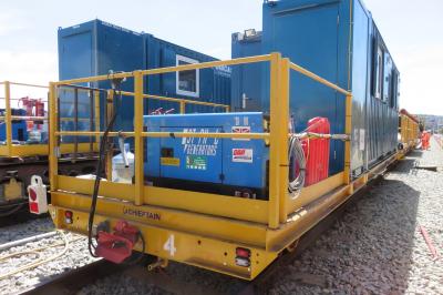 image showing a large yellow on-track machine