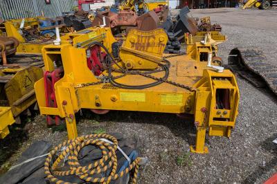 image showing a large yellow on-track machine