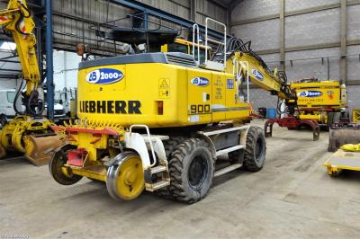 image showing a large yellow on-track machine
