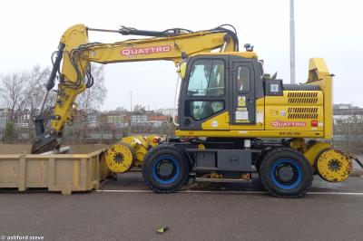 image showing a large yellow on-track machine