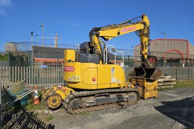 image showing a large yellow on-track machine