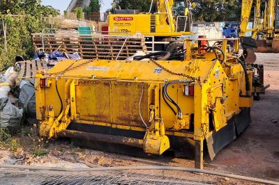 image showing a large yellow on-track machine