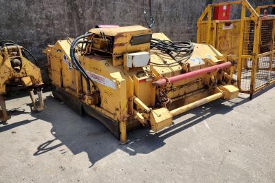 image showing a large yellow on-track machine