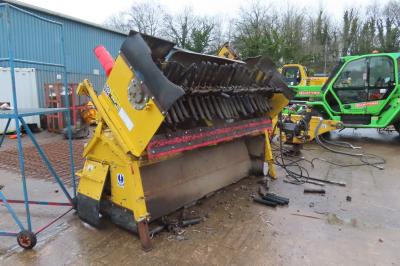 image showing a large yellow on-track machine