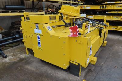 image showing a large yellow on-track machine