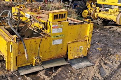 image showing a large yellow on-track machine