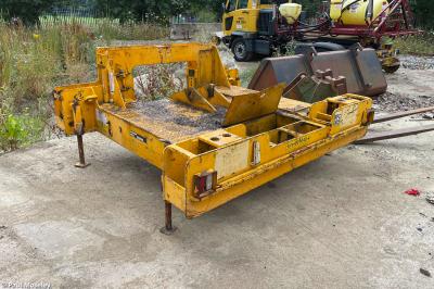 image showing a large yellow on-track machine