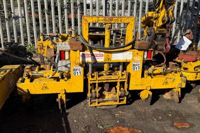 image showing a large yellow on-track machine