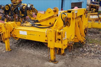 image showing a large yellow on-track machine