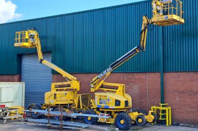 image showing a large yellow on-track machine