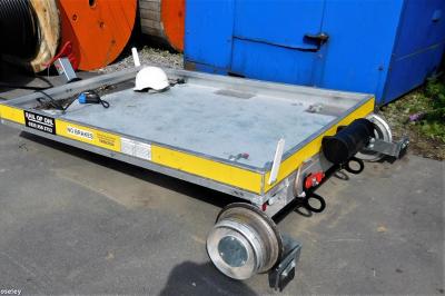 image showing a large yellow on-track machine