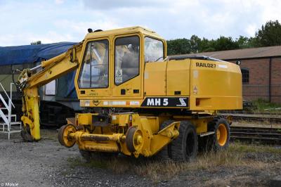 image showing a large yellow on-track machine