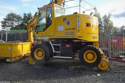 image showing a large yellow on-track machine