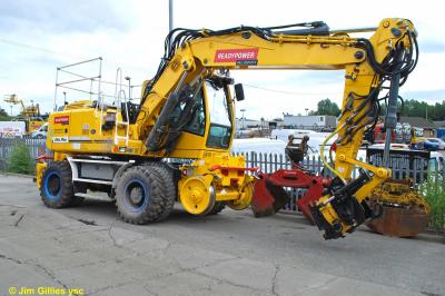 image showing a large yellow on-track machine
