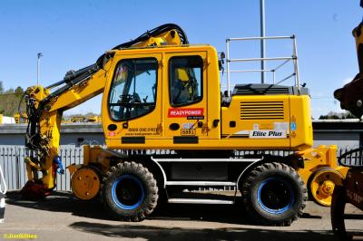 image showing a large yellow on-track machine