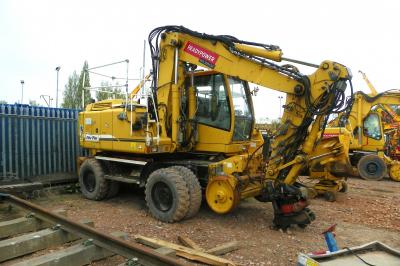 image showing a large yellow on-track machine