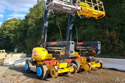 image showing a large yellow on-track machine