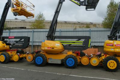 image showing a large yellow on-track machine