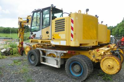 image showing a large yellow on-track machine
