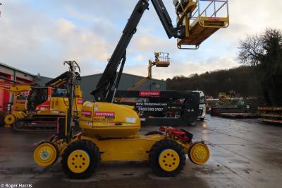 image showing a large yellow on-track machine