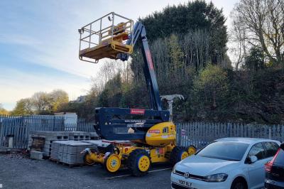 image showing a large yellow on-track machine