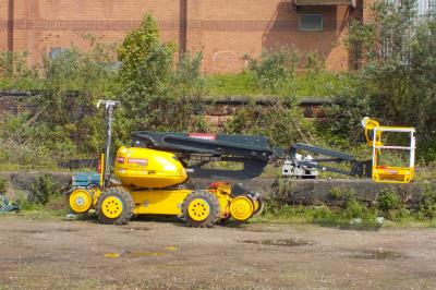image showing a large yellow on-track machine