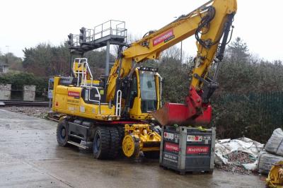 image showing a large yellow on-track machine