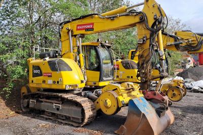 image showing a large yellow on-track machine
