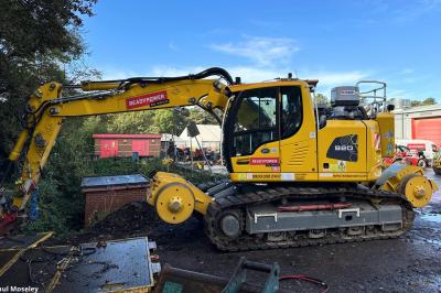 image showing a large yellow on-track machine