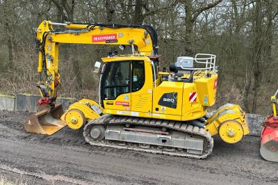 image showing a large yellow on-track machine