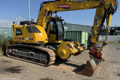 image showing a large yellow on-track machine