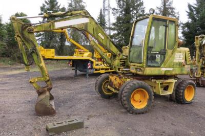 image showing a large yellow on-track machine