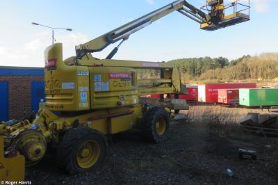 image showing a large yellow on-track machine